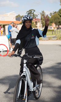 A Happiness Cycle participant test rides her new bike